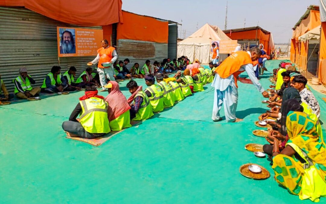 Serving free food to Kumbh Mela workers